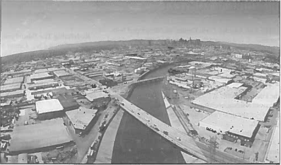 An overhead picture of the Los Angeles River with downtown LA in the background.